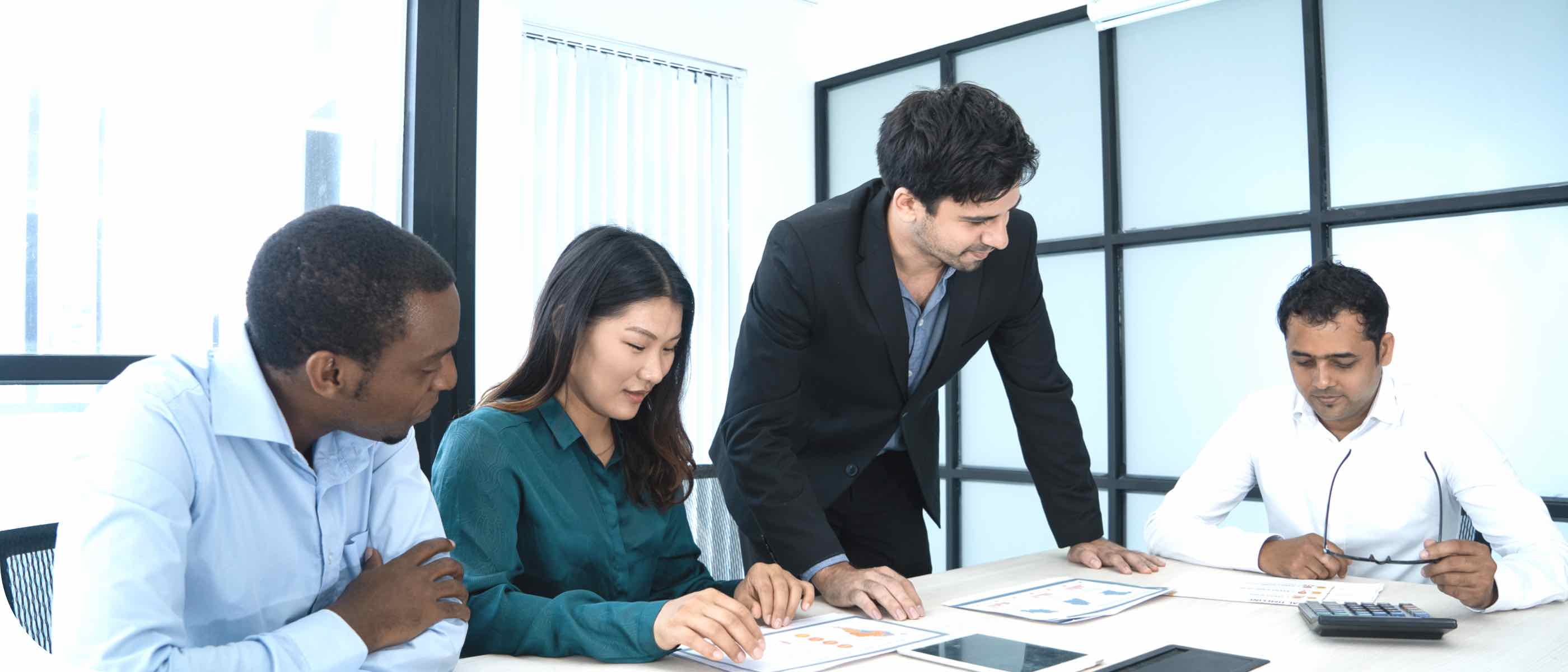 People at a table doing market research